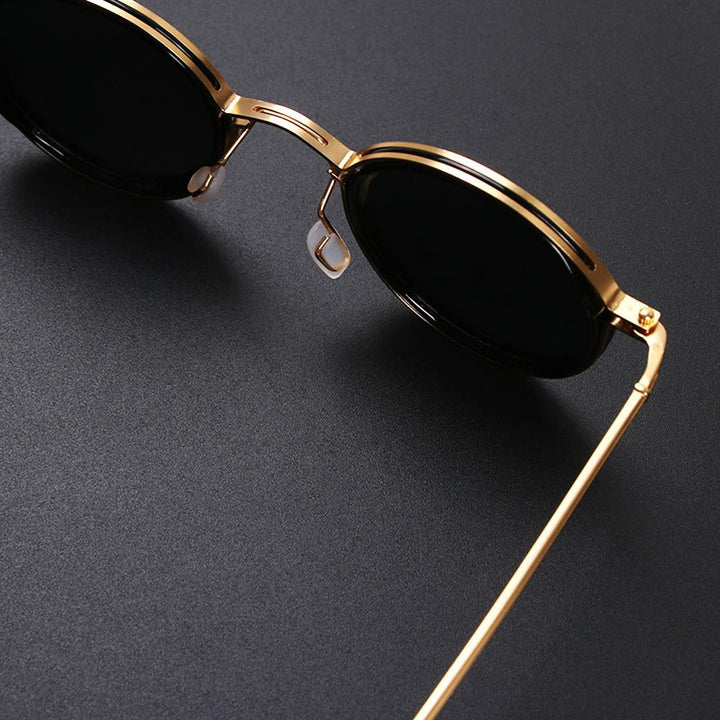 Polarized round sunglasses with elegant gold metal temples; perfect for glare reduction & UV eye protection.