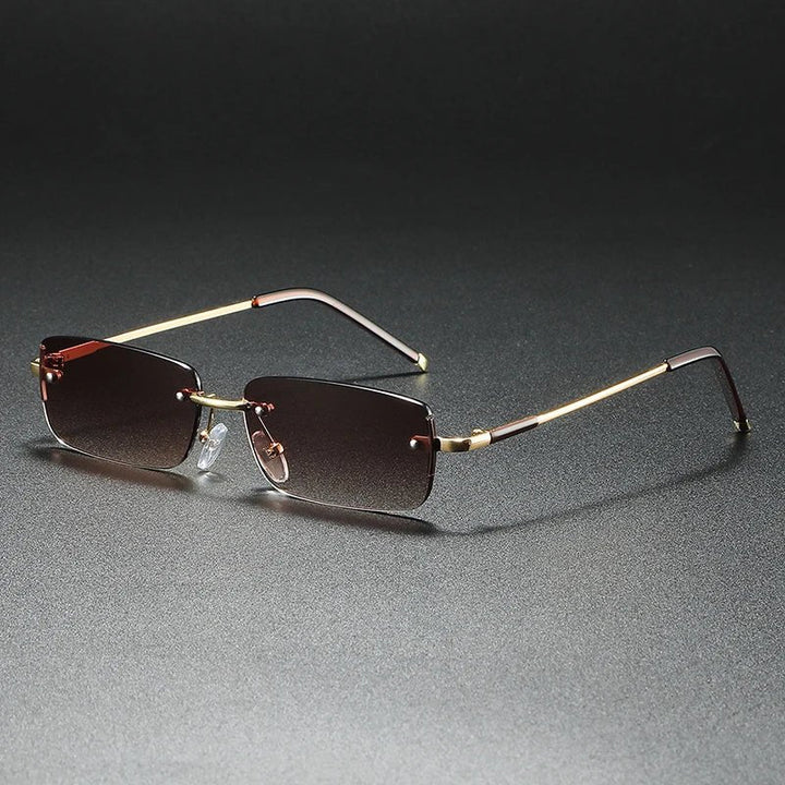 Protect your eyes with these unisex gold rimless rectangular gradient sunglasses. Lightweight & stylish modern eyewear.