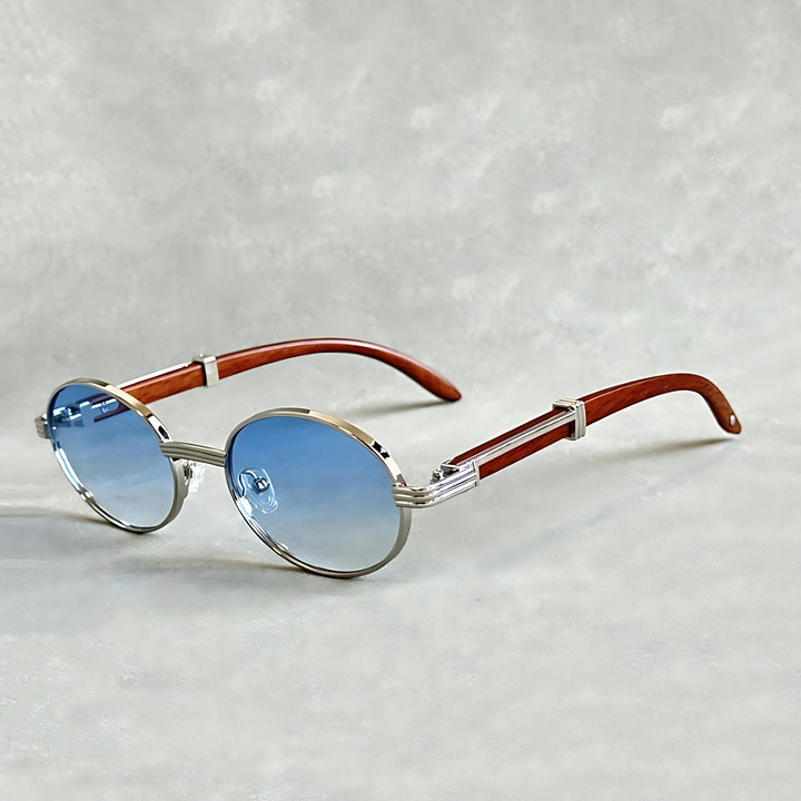 Fashionable unisex round gold frame designer eyewear, a chic luxury accessory.