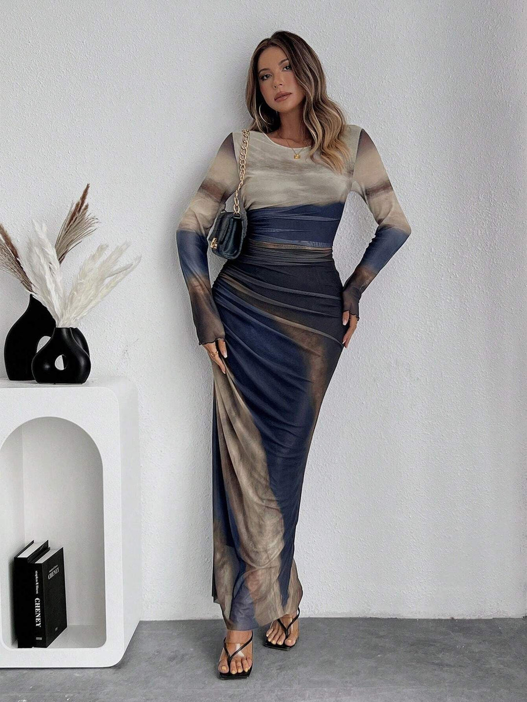 Women's sophisticated long sleeve bodycon maxi dress. A versatile, figure-flattering evening or party look.