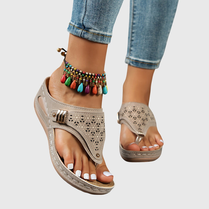 Step into summer with Theodoros women's platform sandals, featuring a chunky heel & perforated upper.