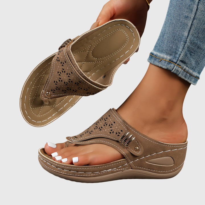 Theodoros comfortable women's platform sandals with an open toe, ankle strap & elegant perforated design.