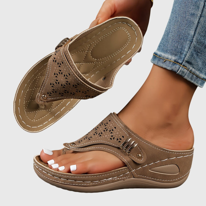 Modern Theodoros platform sandals for women, featuring a secure ankle strap & comfortable perforated design.