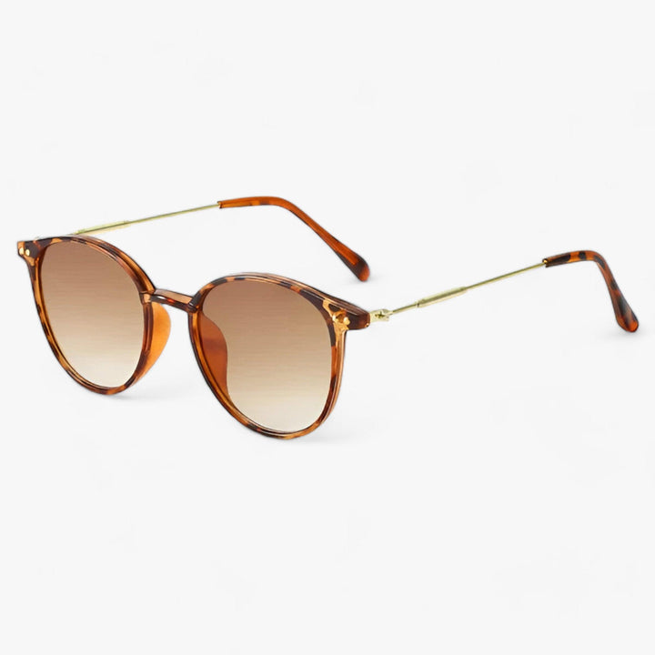 Luxurious women's round frame sunglasses, a chic fashion accessory. Elegant retro design with excellent UV protection.