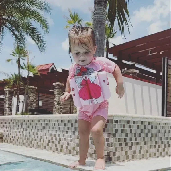Toddler float vest with UV 50+ sun protection & built-in shorts for safe swimming.