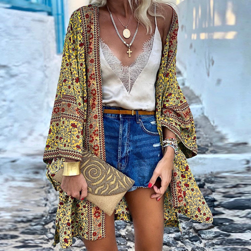 Trendy women's boho patterned cardigan with a loose fit, perfect for casual wear & layering. Features vibrant ethnic print.