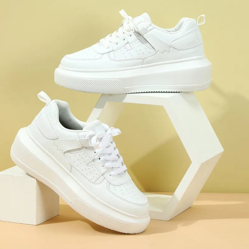 Trendy women's platform sneakers with perforated detail and lace-up closure for casual, comfortable style.