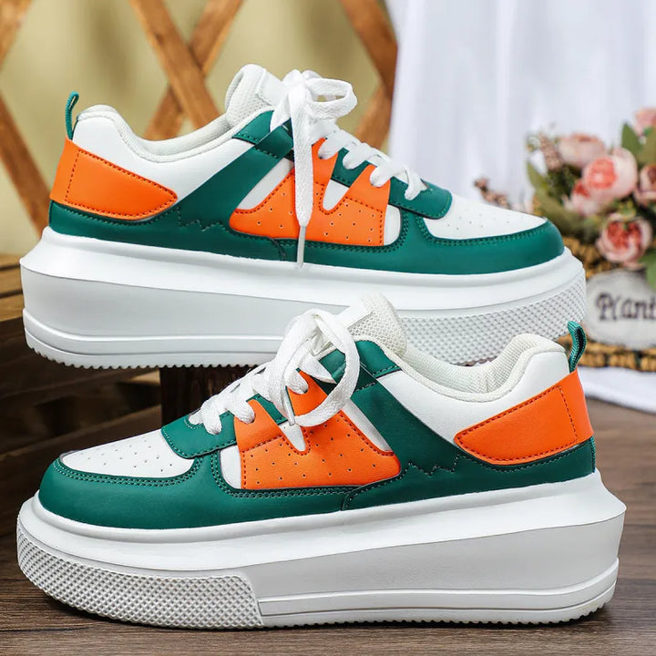 Comfortable women's platform sneakers, perforated for breathability, with practical lace-up for casual wear.