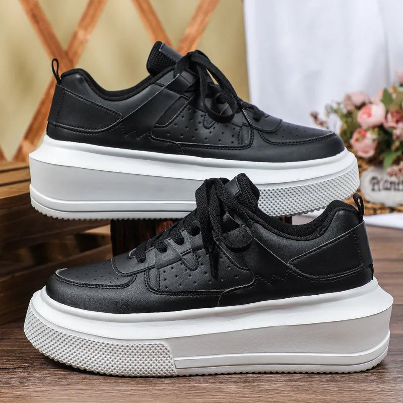 Modern women's perforated platform sneakers with lace-up closure, perfect for trendy and comfortable everyday fashion.