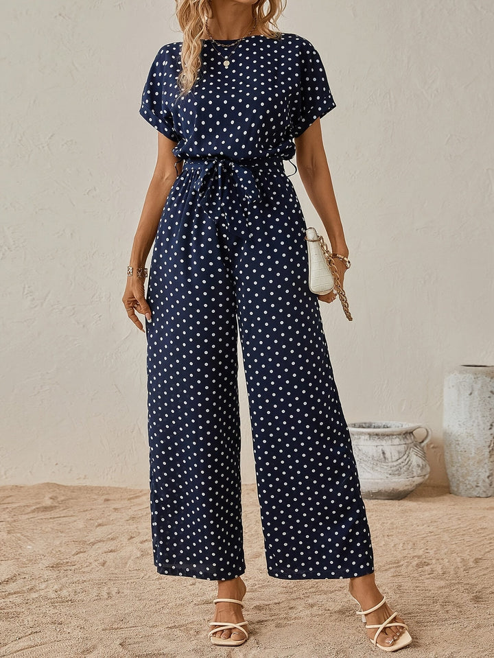 Comfortable women's polka dot one-piece jumpsuit with elastic waist, ideal for spring & summer fashion.