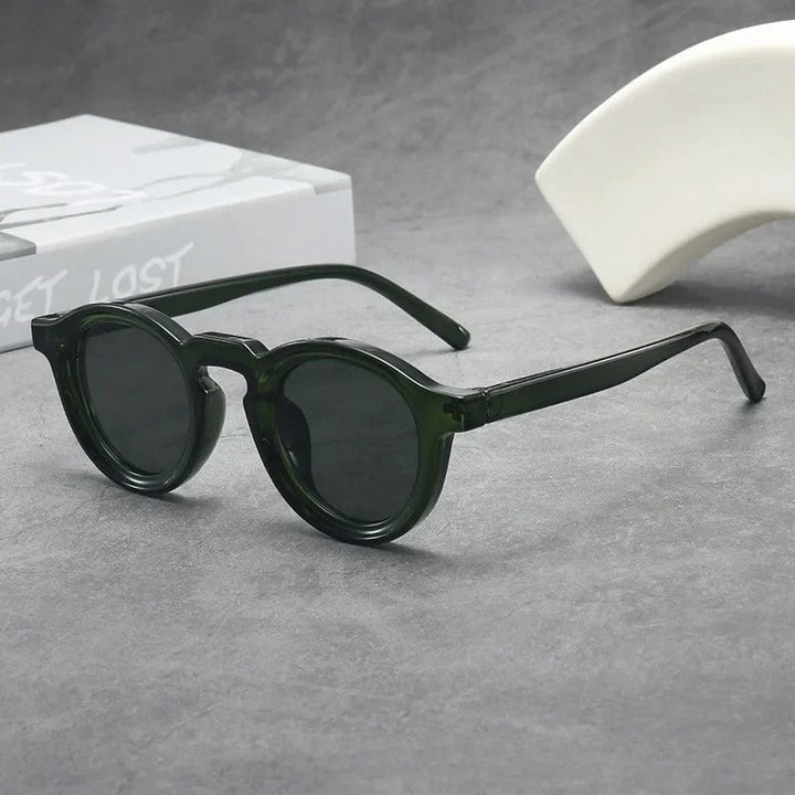 Lightweight unisex round tinted sunglasses ensuring comfort & style. Essential everyday eyewear accessory.