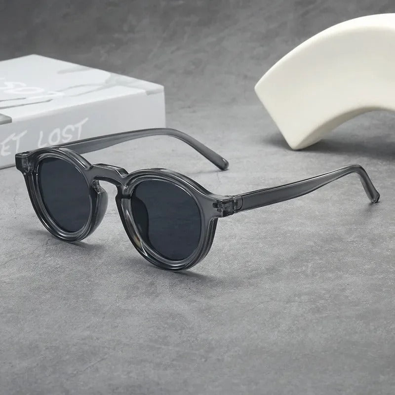 Classic round tinted sunglasses in unisex design. Stylish eyewear for everyday comfort & protection.