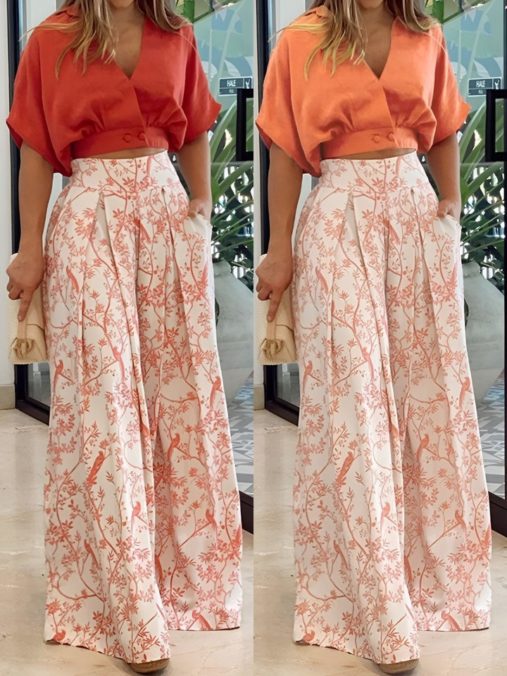 Lightweight women's two-piece summer set. Features a flowy three-quarter sleeve blouse & wide-leg pants for comfort & style.