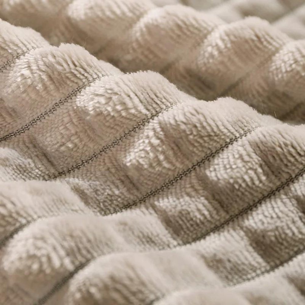 Small pet bed, fleece material, providing cozy comfort and a secure spot for cats or dogs.