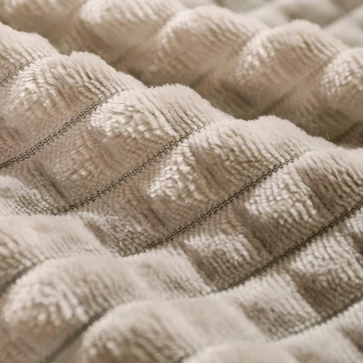 Small pet bed, fleece material, providing cozy comfort and a secure spot for cats or dogs.