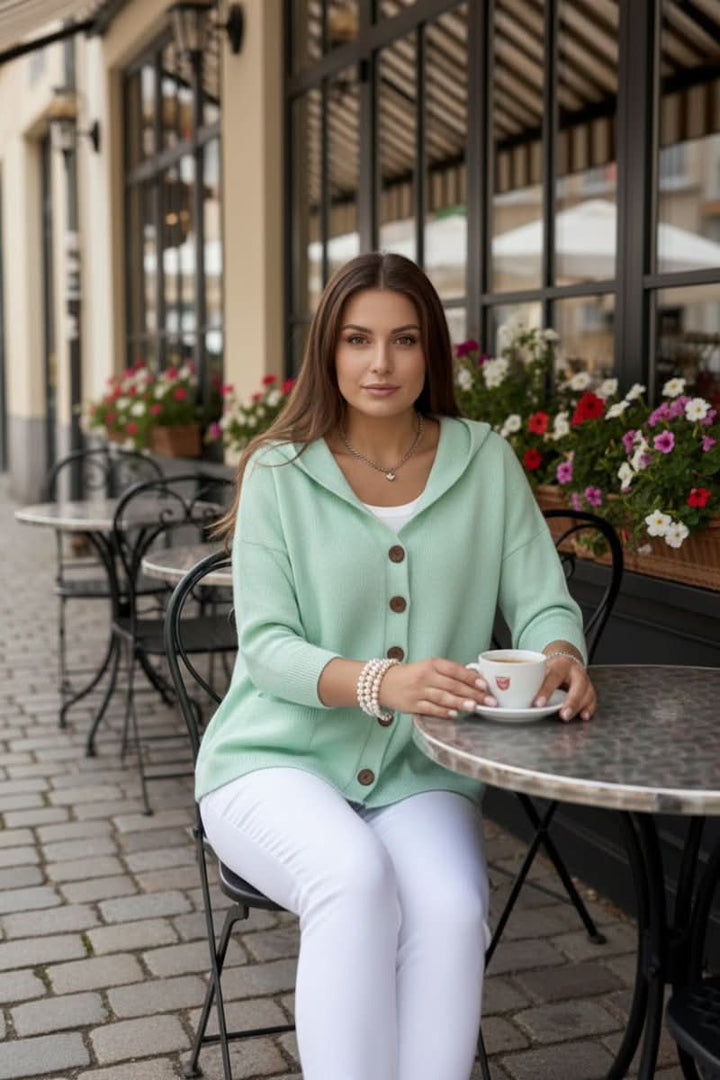 Stylish women's hooded cardigan, a cozy knit for casual winter fashion and warmth.