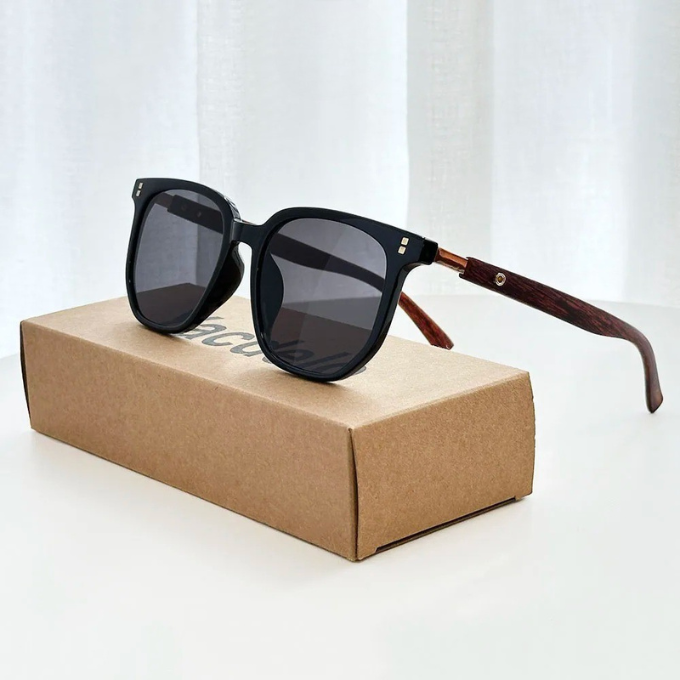 Close-up of lightweight unisex sunglasses with a refined wood frame and contrasting acetate details.