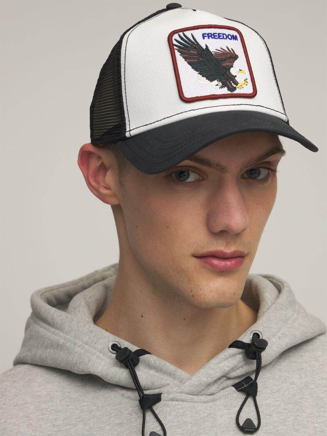 Versatile unisex adjustable cap, featuring a freedom eagle. Suitable for sun protection, active wear & casual style.