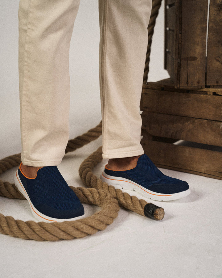 Unisex slip-on slides from above, showcasing the wide footbed and simple, backless design.