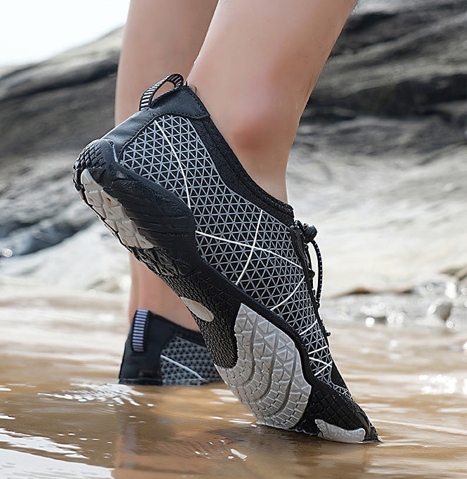 Lightweight quick-dry water shoes with a flexible sole for beach, river, and pool. Unisex design.