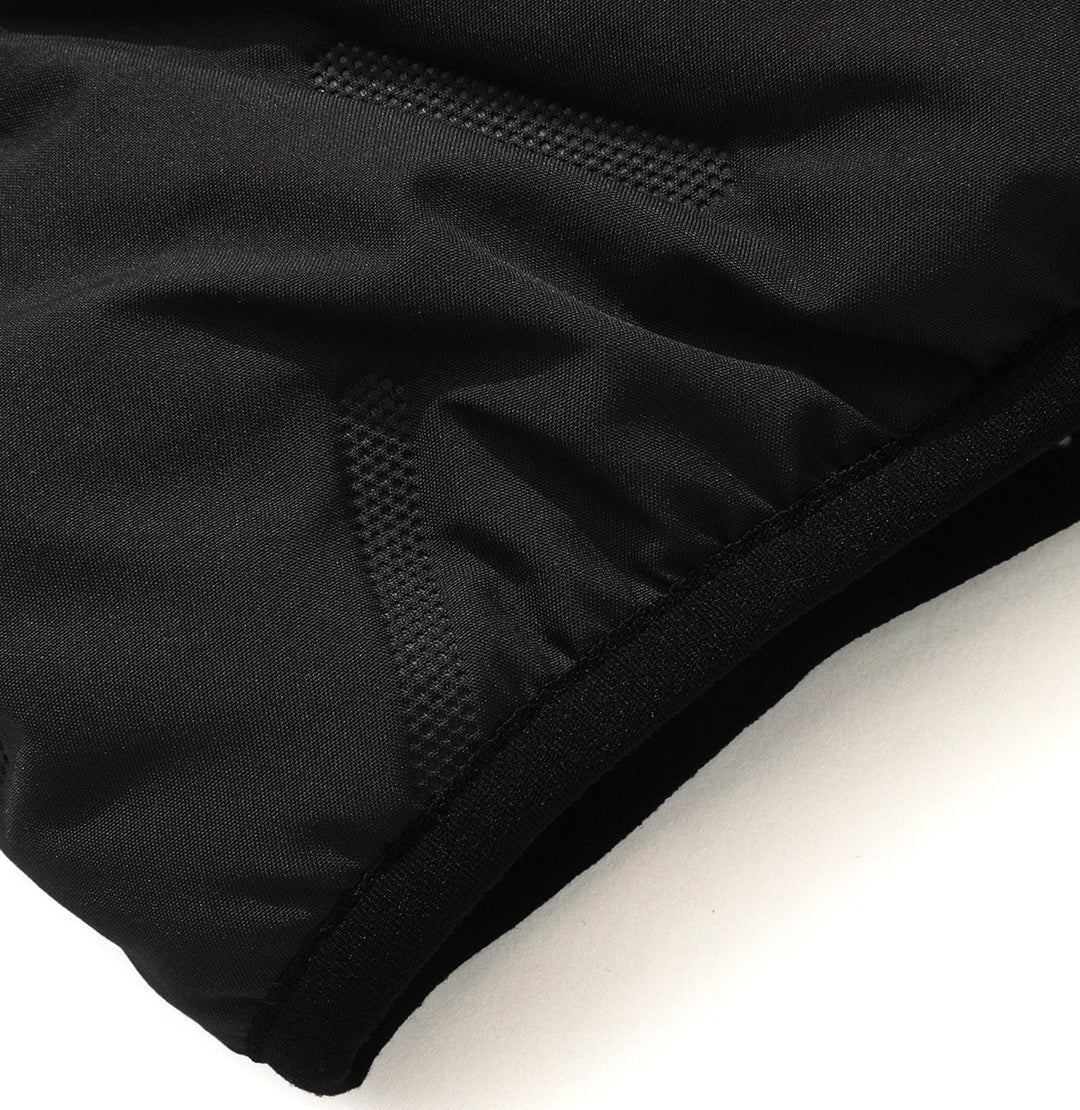 Unisex quilted puffer vest draped over a chair, showing its soft texture and comfortable, casual appeal