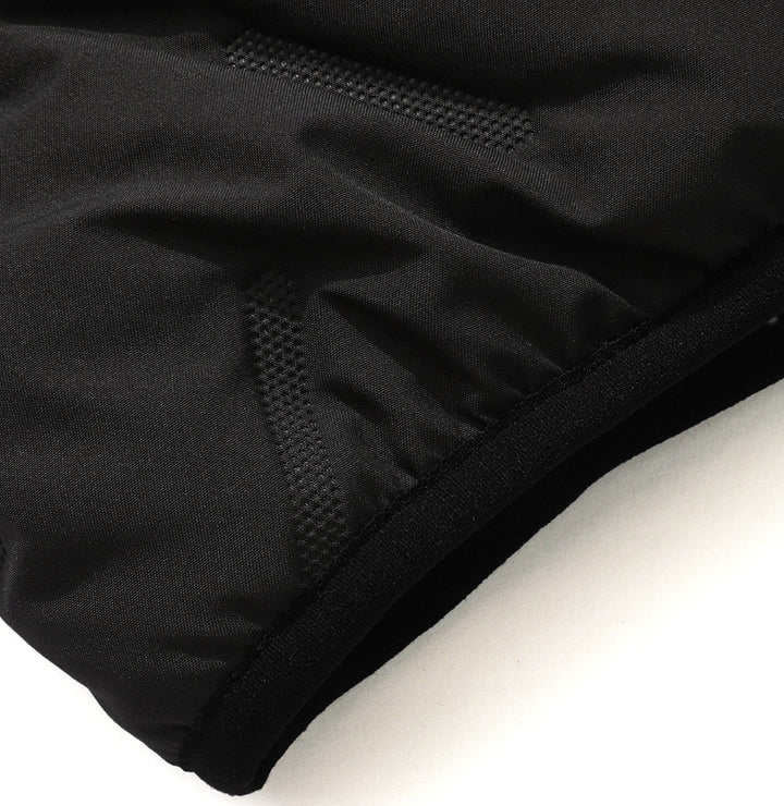 Unisex quilted puffer vest draped over a chair, showing its soft texture and comfortable, casual appeal
