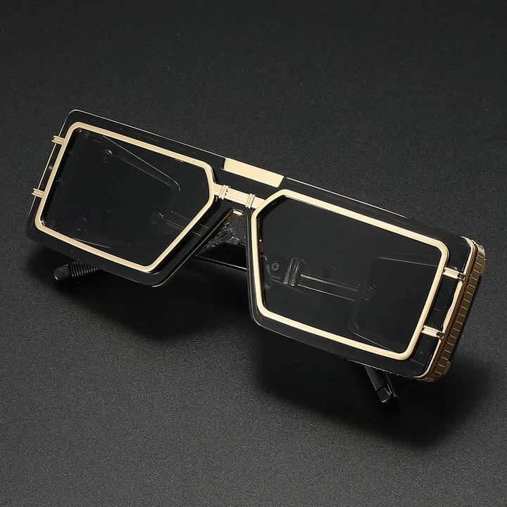 A pair of unisex geometric aviator sunglasses with a bold frame, golden details, and UV400 protection.