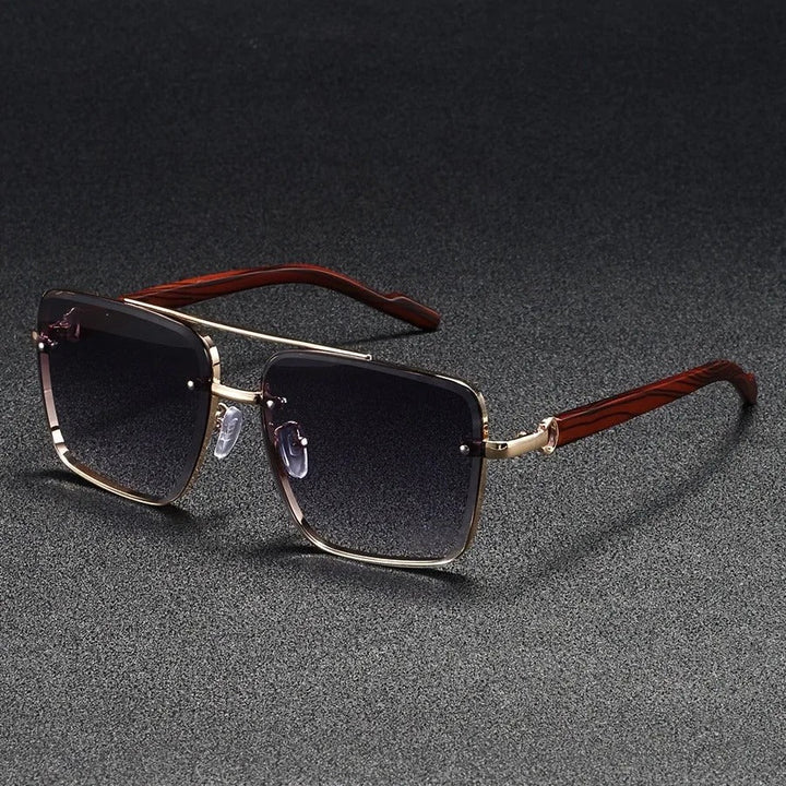 Close-up of the lens and frame of bold square unisex sunglasses in gold and wood, vintage style.