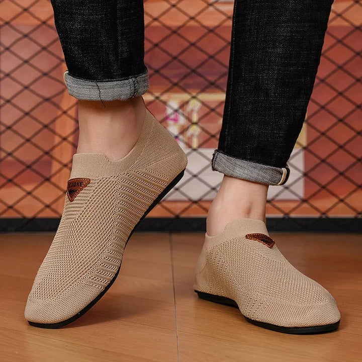 Unisex slip-on shoes with flexible knit material, emphasizing breathable design.