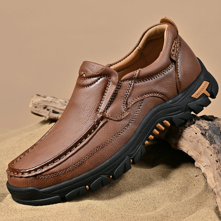 Side profile of a brown orthopedic comfort leather boot for men, transition style, ankle support