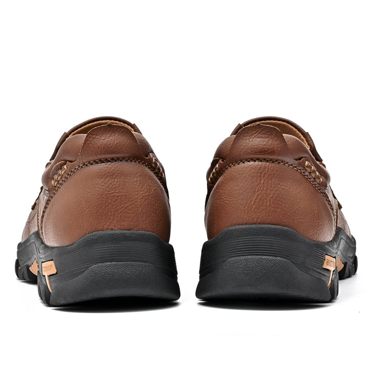 Detail of the slip-resistant sole on a brown unisex orthopedic comfort transition boot, good grip