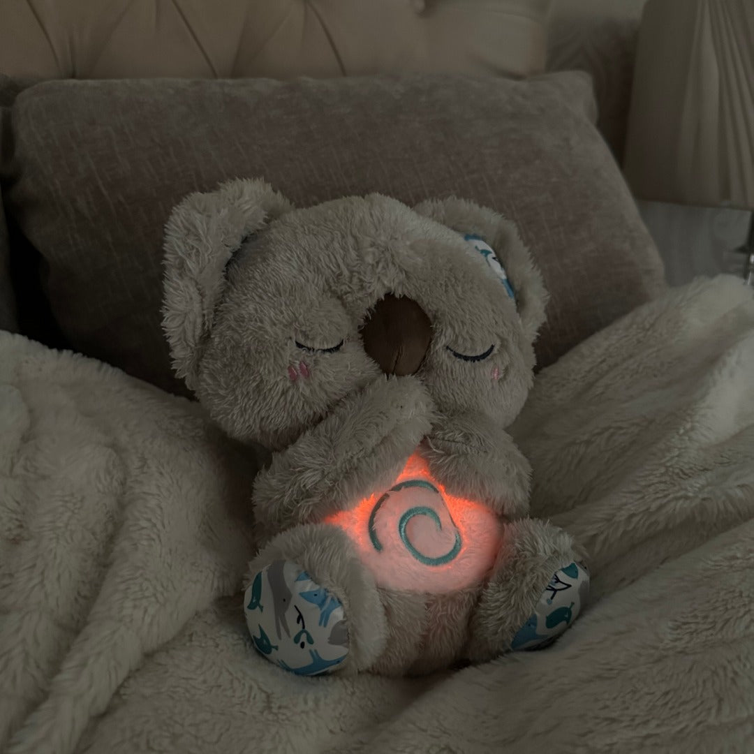 Plush Koala breathing aid offers stress relief & deep relaxation. A comfort toy for peaceful sleep.