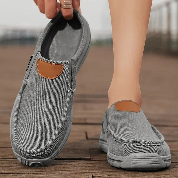Relaxed fit canvas slip-on shoes, combining comfort and simple unisex design.
