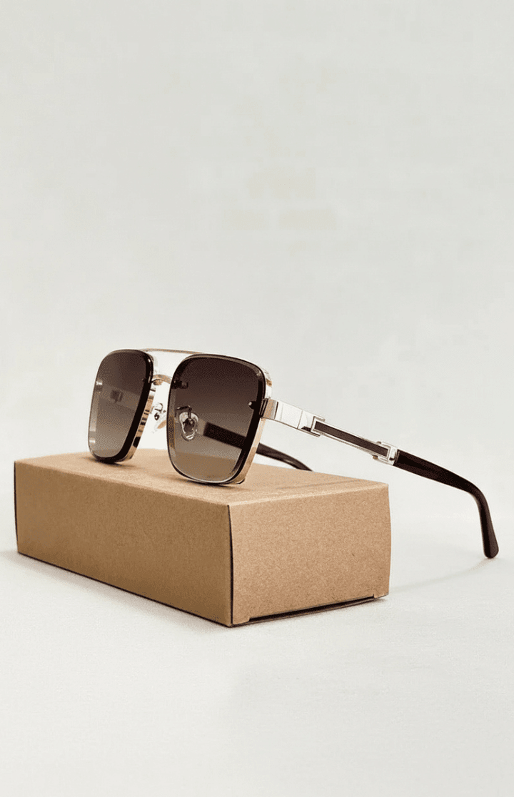 Close-up of classic unisex aviator sunglasses, showcasing metal frame & UV400 lenses.
