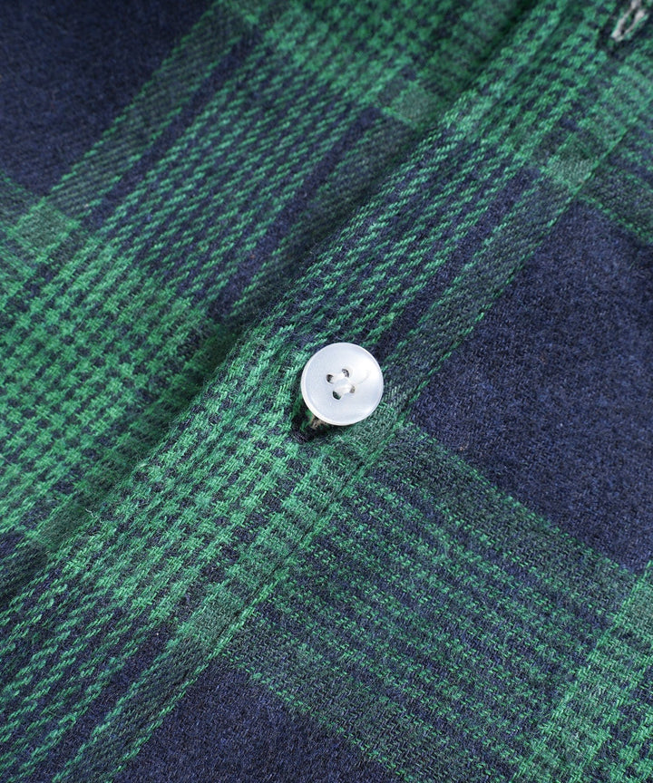 Side profile of a warm flannel shirt jacket, ideal for layering, unisex fit.