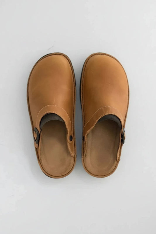 Front view of a supportive clog, highlighting its simple, durable design for unisex daily comfort.