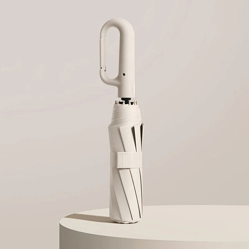 "Unisex compact umbrella with UV protection, featuring a reinforced frame, sleek design, and ergonomic handle in various colo
