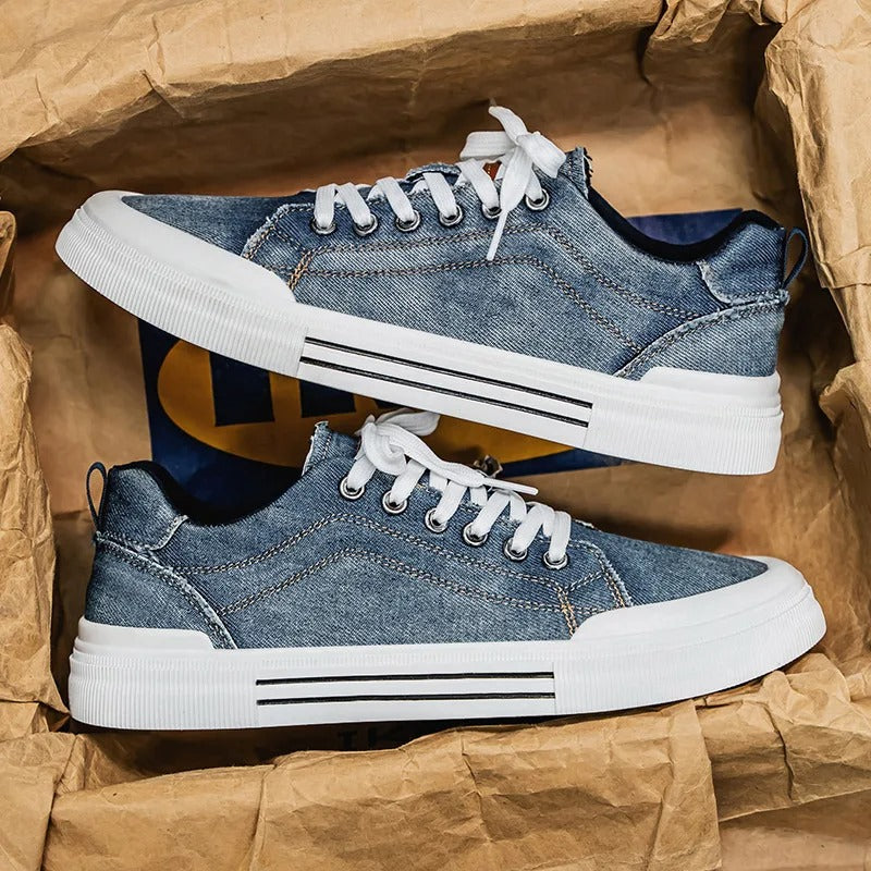 Unisex low-top canvas sneakers in denim, offering a stylish and comfortable option for casual outfits.
