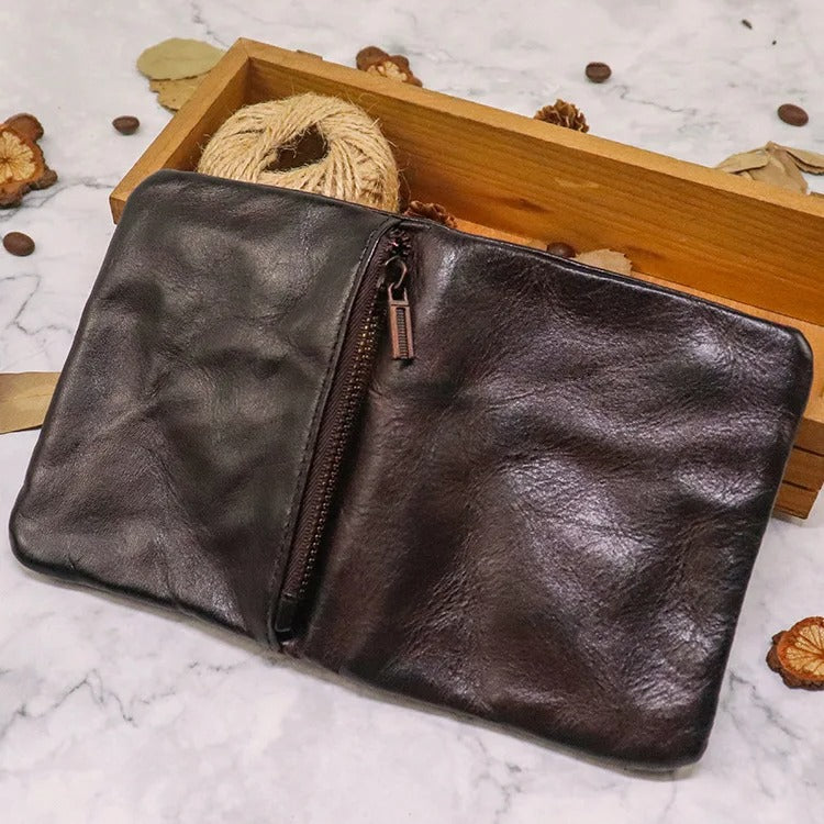 Aged leather wallet for men and women, featuring a prominent snap closure