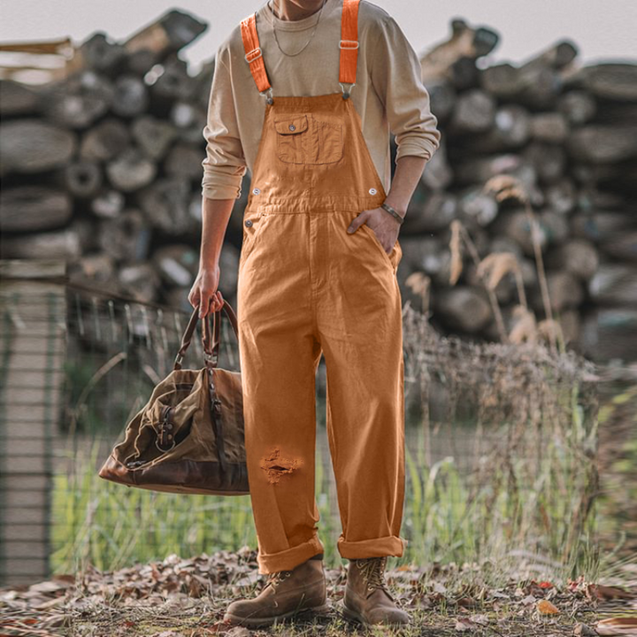 Versatile unisex gardening overalls in blue/brown. Durable & comfortable workwear with utility pockets & adjustable fit.