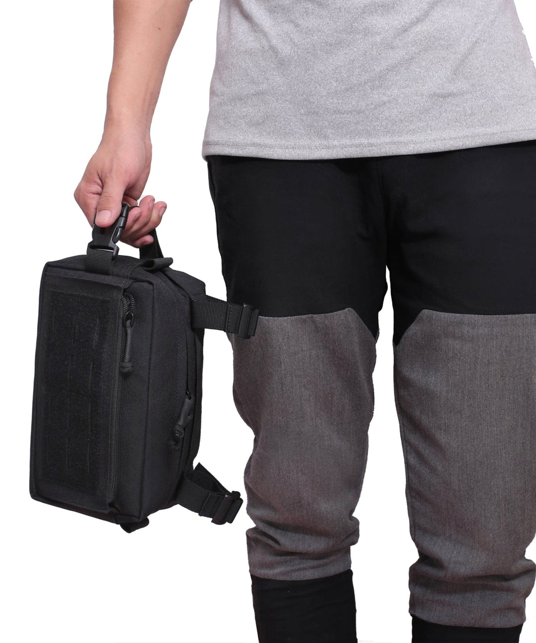 Everyday Carry Sling Bag next to a laptop, illustrating its perfect size for smaller tech