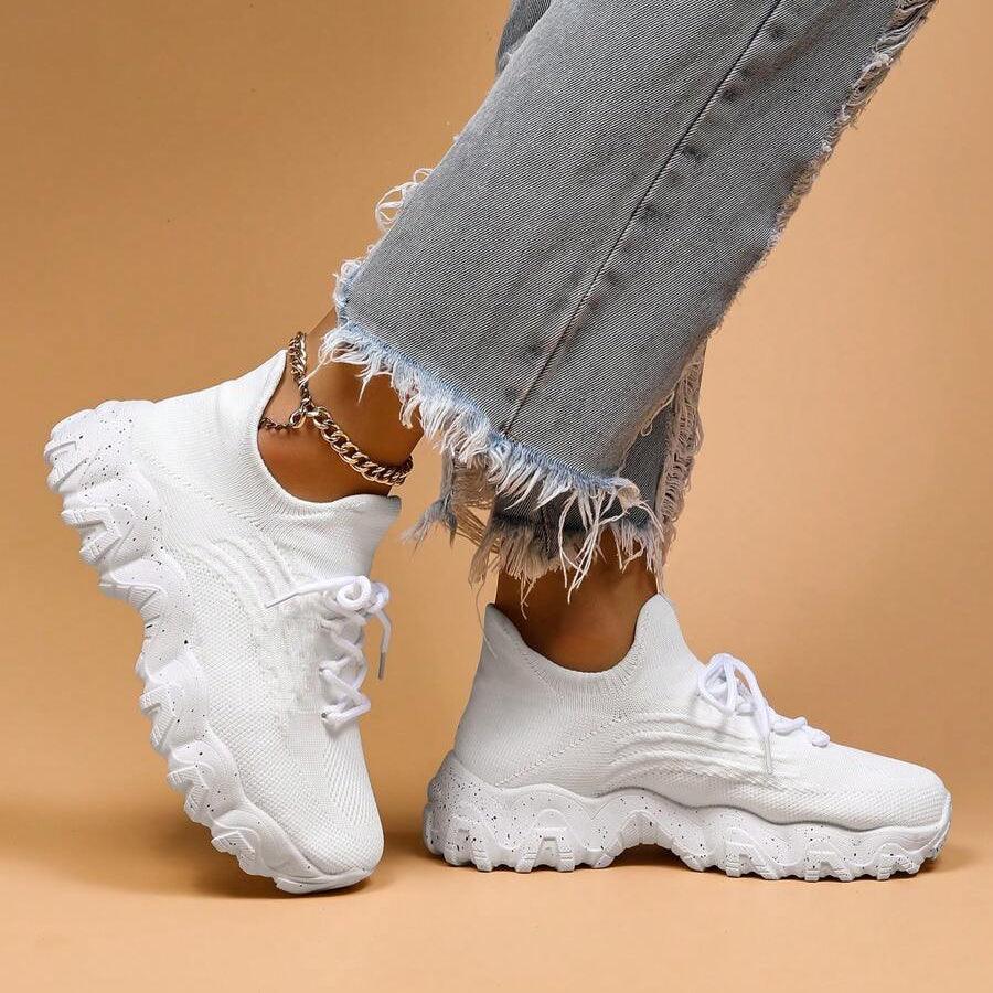 Detail of the lace-up closure on Unisex Everyday Comfort Low-Top Sneakers, ensuring a snug and adjustable fit