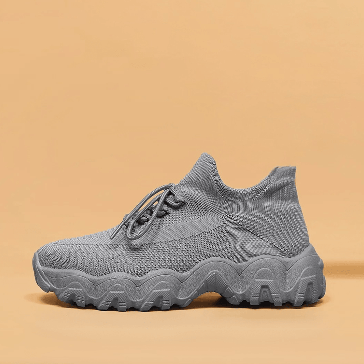Unisex Everyday Comfort Low-Top Sneakers with a subtle logo detail, maintaining a clean aesthetic