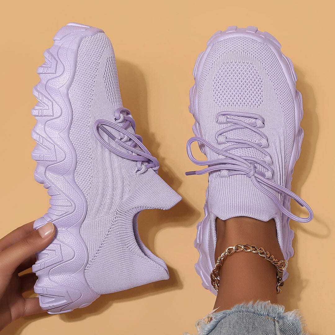 Unisex Everyday Comfort Low-Top Sneakers worn with jeans, showcasing their everyday casual appeal and versatility