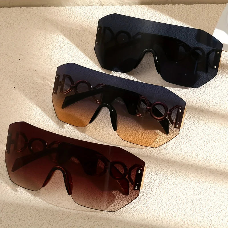 Detailed shot of the frameless construction and luminous lens of these unisex futuristic sunglasses