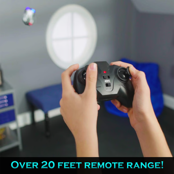 Kids playing with a blue RC wall climbing car, gravity-defying electronic toy for thrilling adventures.