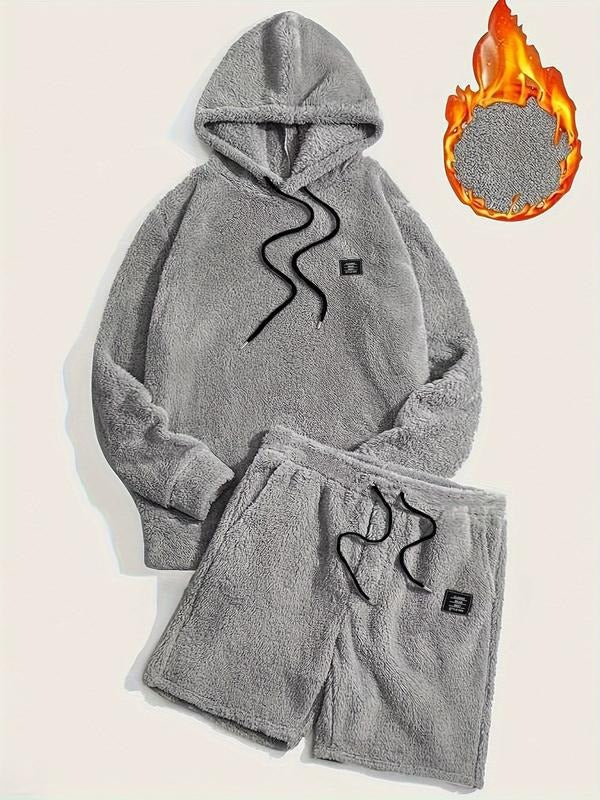 Unisex hooded fleece top and short bottoms in a matching set, providing cozy and stylish comfort clothing.