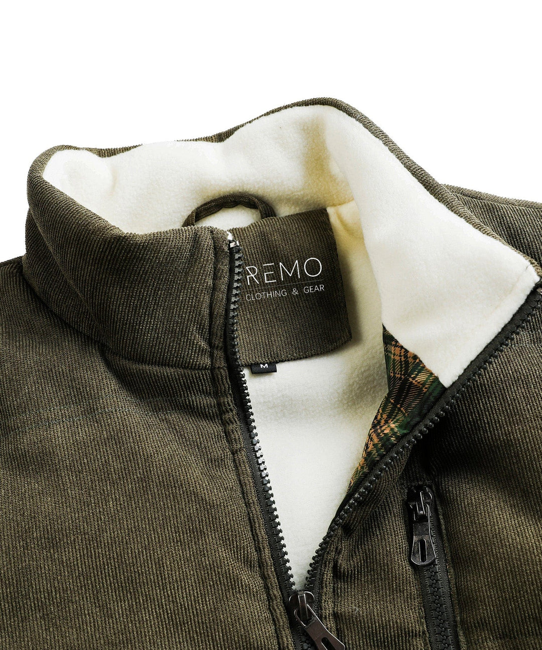 Green insulated vest, unisex, hanging on a rack in an outdoor store