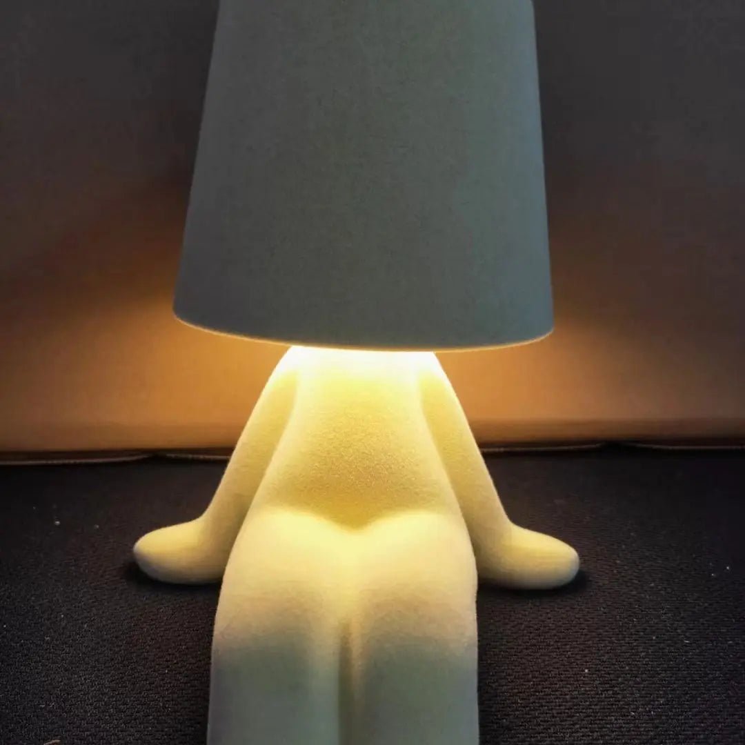 Elegant human form LED lamp, providing soft, creative lighting for modern homes & offices.