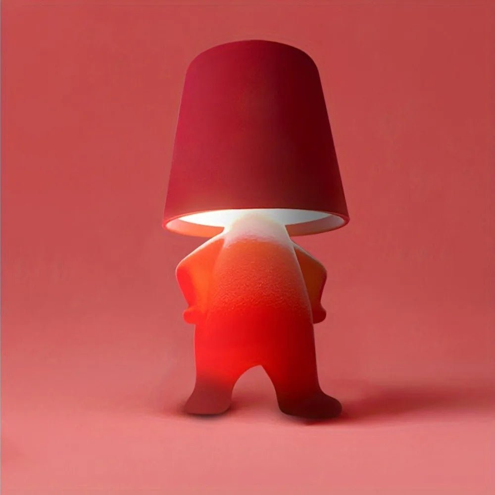 Rechargeable human figure LED light, portable and modern for creative desk lighting & mood ambiance.